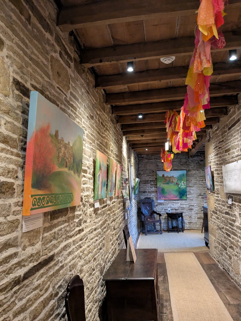The entrance hall at East Riddlesden Hall, National Trust, with artworks on displayed